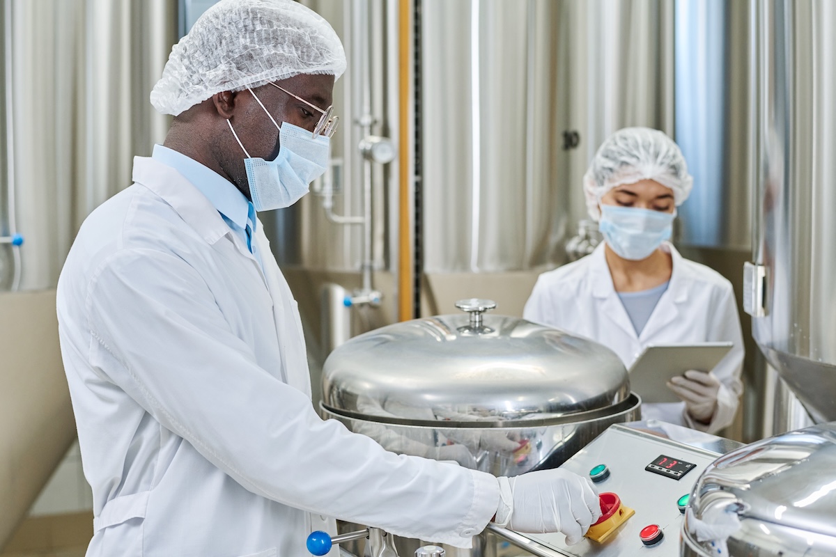 Engineer working with assistant at factory